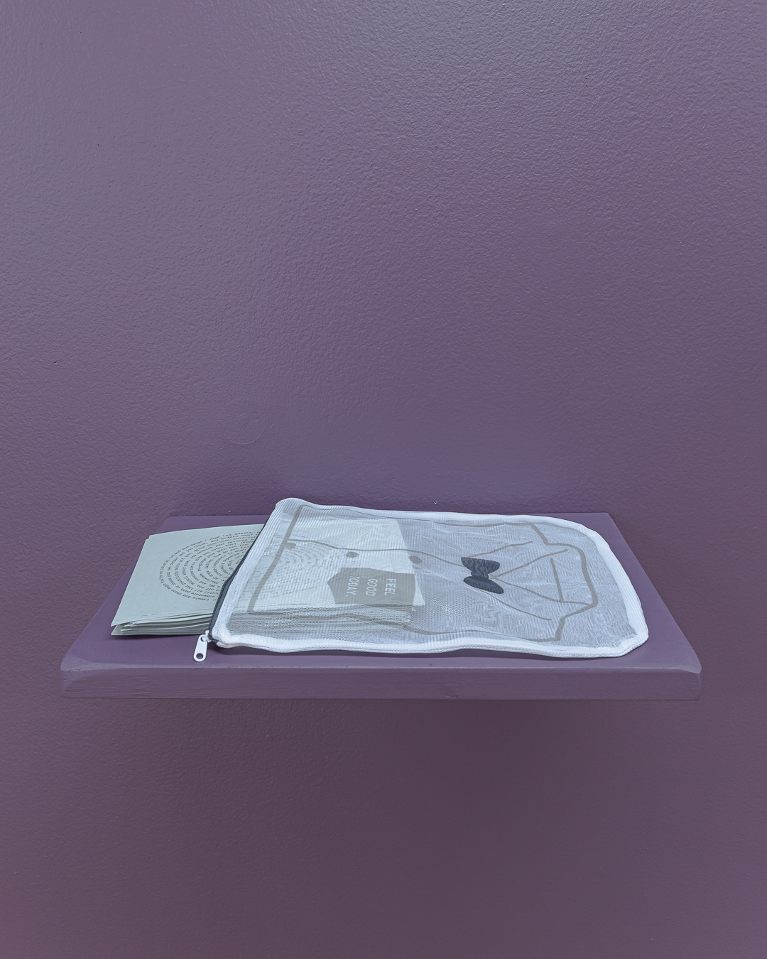 Audrey Pfister, <em>post-post-post -femminie-urge-grindset rebirth</em>, 2023, mesh laundry bag, text on grey 80gsm paper, 30x25cm, Pari. Photo: Document Photography