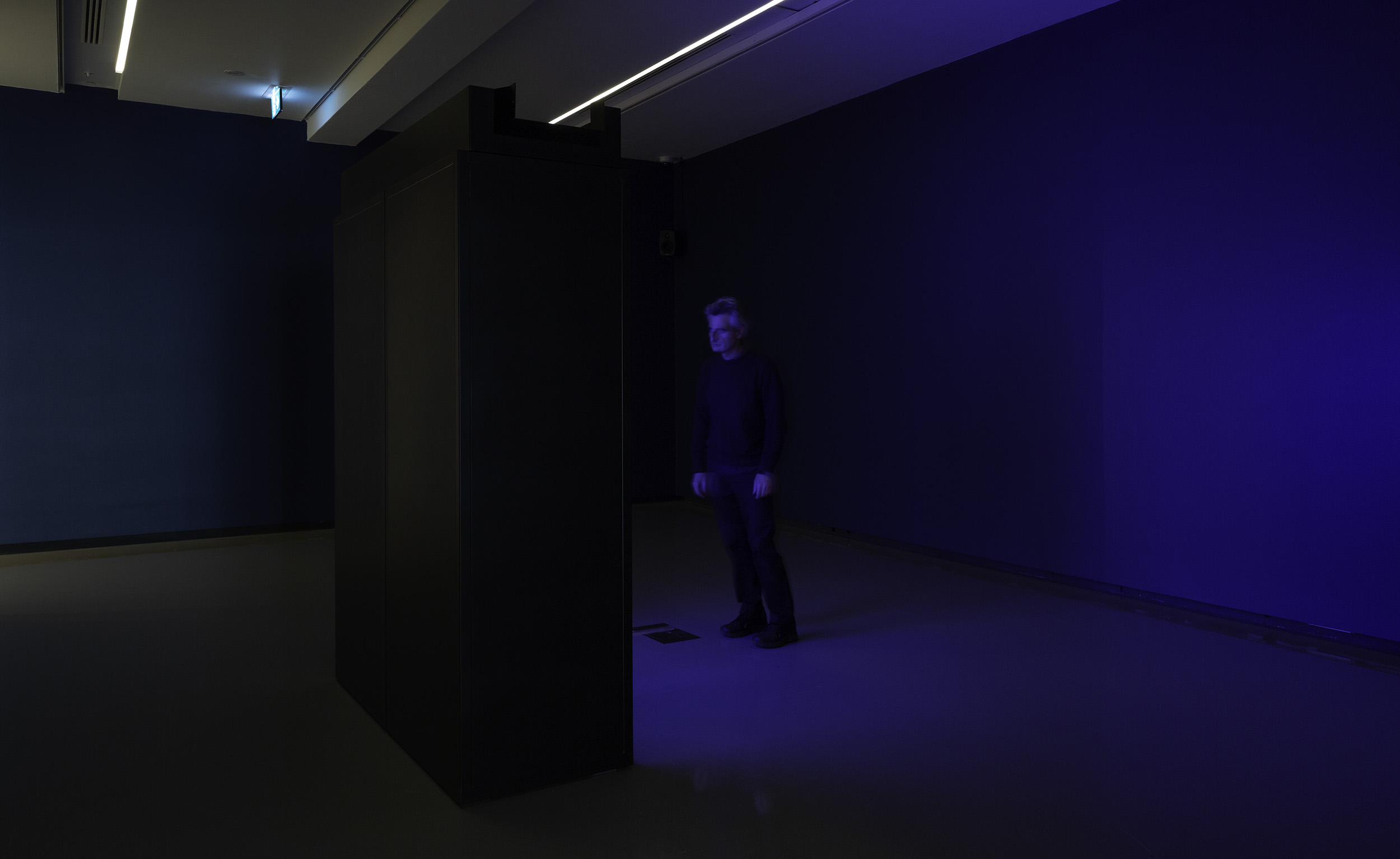 Installation view of Paul Knight, <em>Naked Souls</em>, 2023, 2 OpenAI GPT-2 open-source artificial intelligence large language models (LLM), computer console, monitors, steel cabinets and sound. Co-commissioned by Monash University Museum of Art | MUMA, UNSW Galleries and Perth Institute of Contemporary Arts. Courtesy of the artist and Neon Parc, Naarm/Melbourne. <em>Paul Knight: L’ombre de ton ombre</em>, Monash University Museum of Art, Naarm/Melbourne, 2023. Photo: Christian Capurro