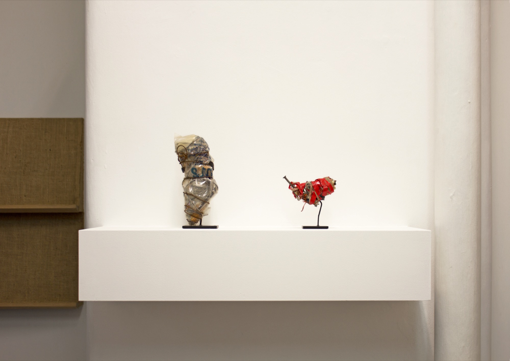 Philadelphia Wireman, <em>Untitled (Plastic bag with blue writing)</em>, c. 1970–1975, Wire, found objects, Mixed media, 7 1/4 x 2 3/4 x 2 1/2 inches, 18.4 x 7 x 6.4 cm, PW 26. Image courtesy World Food Books.