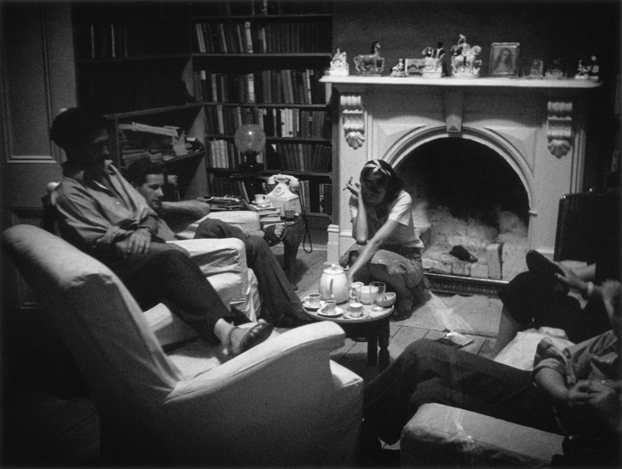 Albert Tucker, <em>In the Library: John Reed, Sidney Nolan and Sunday Reed</em>, c. 1942, gelatin silver photograph, 30.4 x 40.2 cm. Collection: Heide Museum of Modern Art, Melbourne.