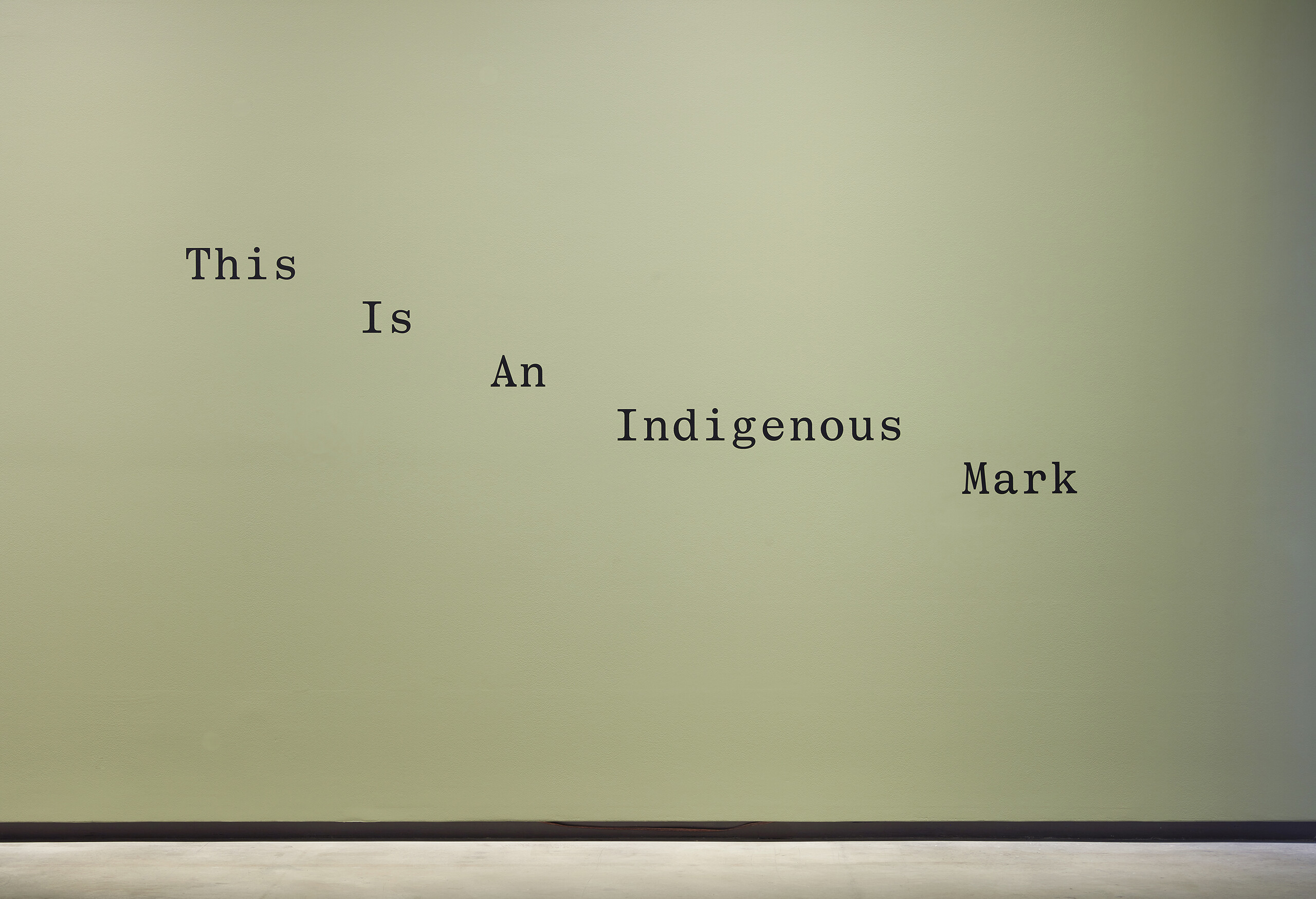 Moorina Bonini, <em>dapalama (between)</em>, 2023, installation view, <em>Primavera 2023: Young Australian Artists</em>, Museum of Contemporary Art Australia, Sydney, 2023, vinyl text, charcoal, image courtesy and © the artist, photograph: Zan Wimberley