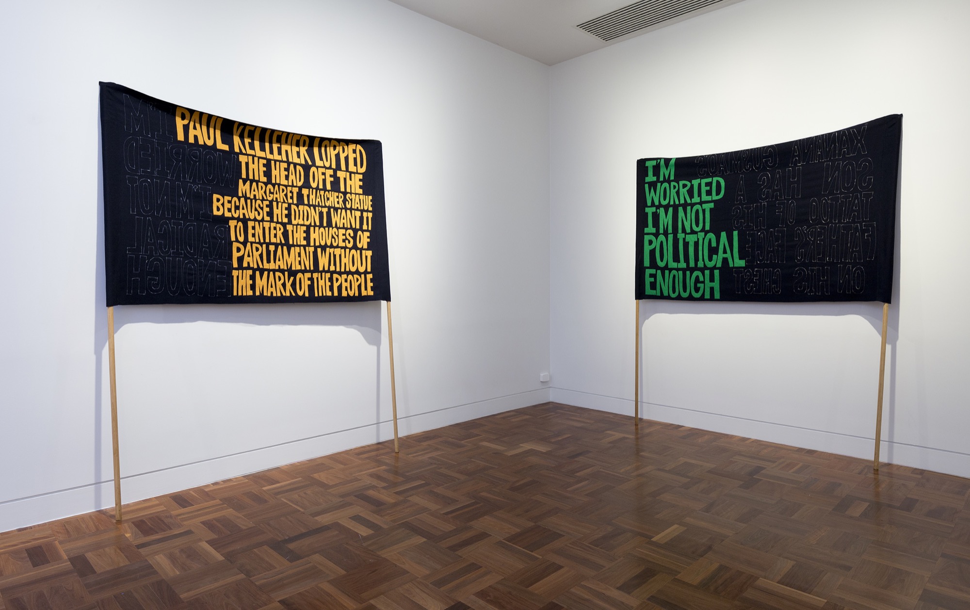 Raquel Ormella, <em>I Hope You Get This</em>, installation view: I’m Worried This Will Become a Slogan (Xanana Gusmao), 1999–2009, double-sided banner, sewn wool and felt, 128 x 202 cm; I’m Worried This Will Become a Slogan (Paul Kelleher), 1999–2009. Courtesy the artist and Milani Gallery, Brisbane. Photo: Christian Capurro.
