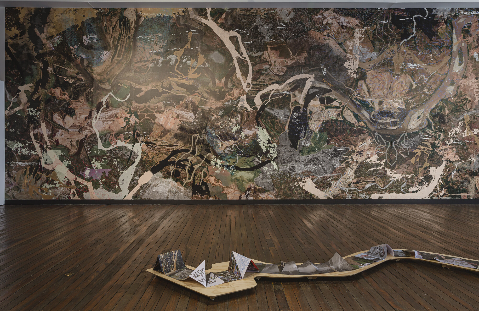 Foreground: Carolina Caycedo, Serpent River Book and Serpent Table, 2017 (detail). Background: Yuma, or the Land of Friends, 2021. Courtesy the artist. Presentation at the 23rd Biennale of Sydney was made possible with generous assistance from the UK/Australia Season Patrons Board, the British Council and the Australian Government as part of the UK/Australia Season. Installation view, 23rd Biennale of Sydney, rīvus, 2022, National Art School. Photography: Document Photography.