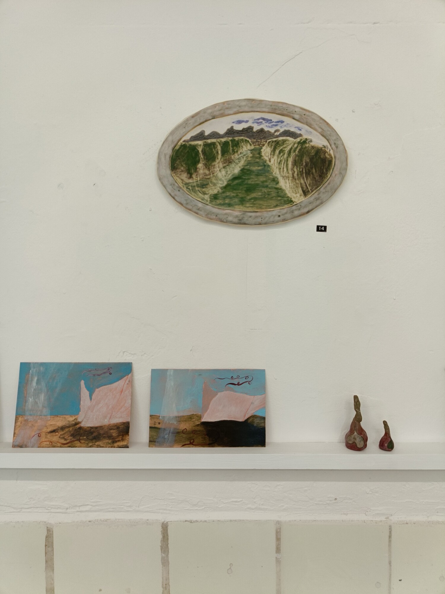 From left to right: Viola Nazario, Netting (1) and Netting (2), 2024, oil on copper sheet, Tiles Lewisham, Sydney. Benita Laylim, Orchard bride, 2024, oxide, stain, glaze on clay, Tiles Lewisham, Sydney. Photo: courtesy of the gallery.
