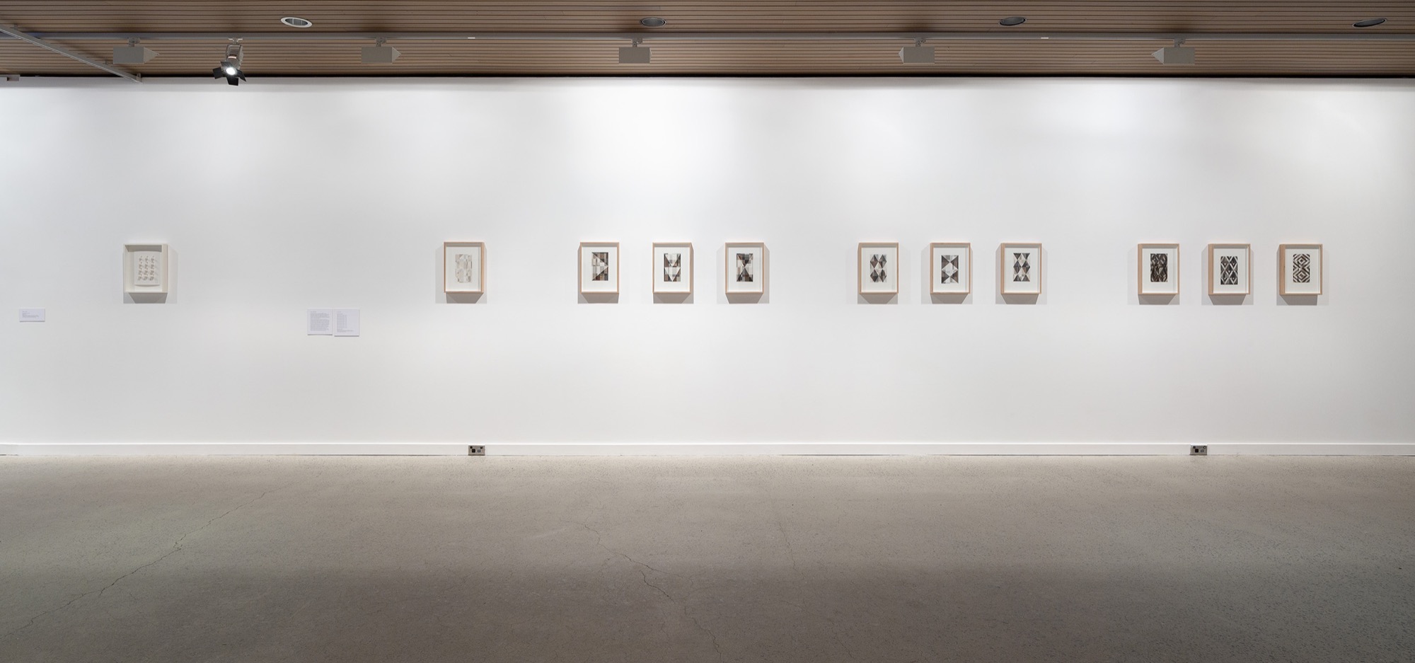 <em>Serial</em>, installation view, McClelland Sculpture Park + Gallery, Langwarrin, 2019. Robert Jacks, <em>45-90 paper cut</em> 2012, Sanné Mestrom, <em>Black painting (study)</em> series 2014. Photo: Christian Capurro.