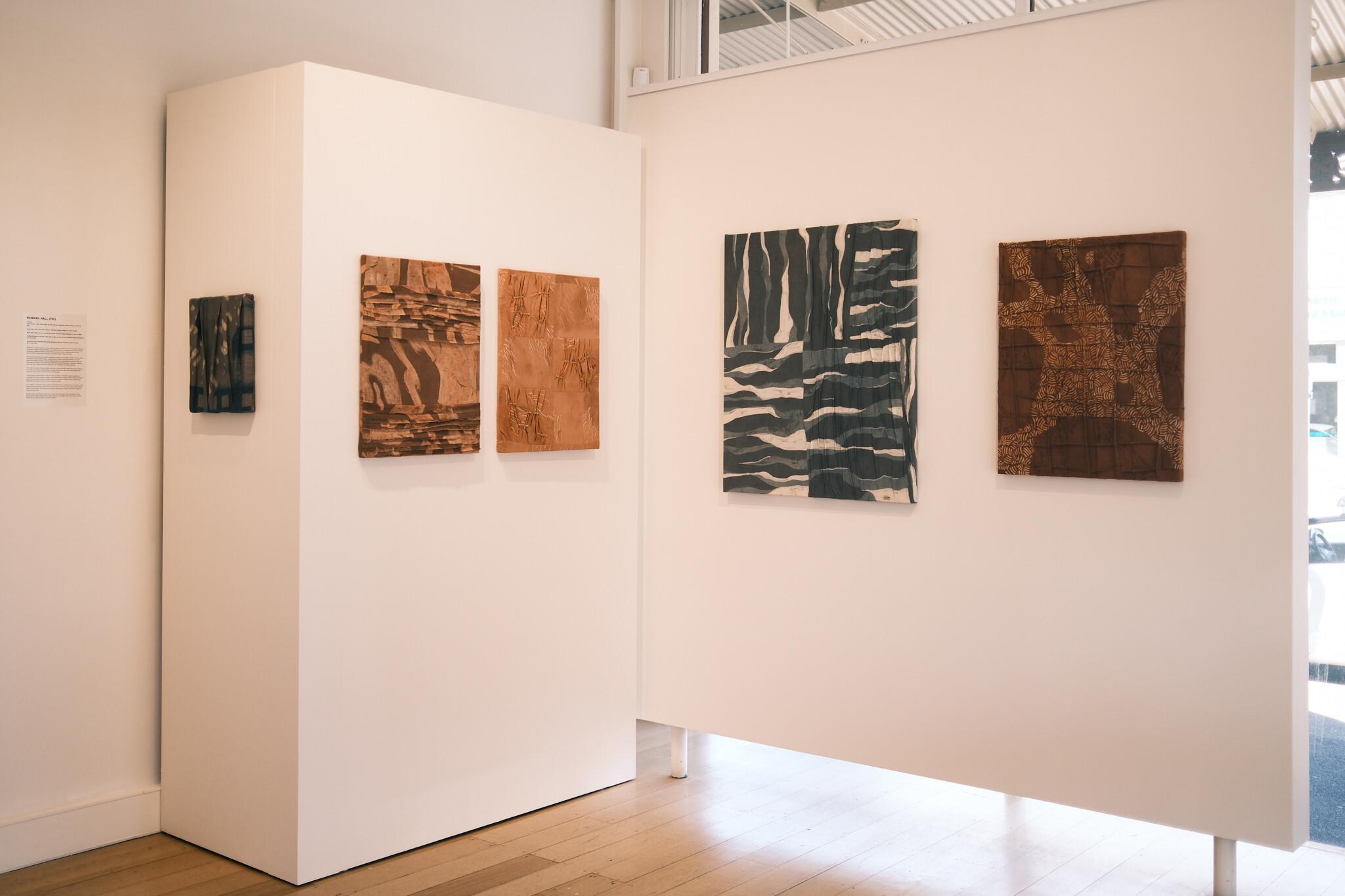 <p>Hannah Hall, from left: <em>Hold It Together</em>, 2024, natural indigo, mud dye, batik wax, handwoven cotton and thread, 31 x 35.5 cm; <em>Rough Patch</em>, 2024, ceriops bark, batik wax, handwoven cotton and thread, 61 x 45.5 cm; <em>Spark</em>, 2024, ceriops bark dye, recycled glass beads, handwoven cotton and thread, 61 x 45.5 cm; <em>The Many Directions of the Heart</em>, 2024, natural indigo overdyed with mud, handwoven cotton and thread, 76 x 91 cm; <em>Roadblocks</em>, 2024, jackwood overdyed with ceriops bark, batik wax, handwoven cotton and thread, 56 x 71 cm. Photo: Tom Hvala</p>