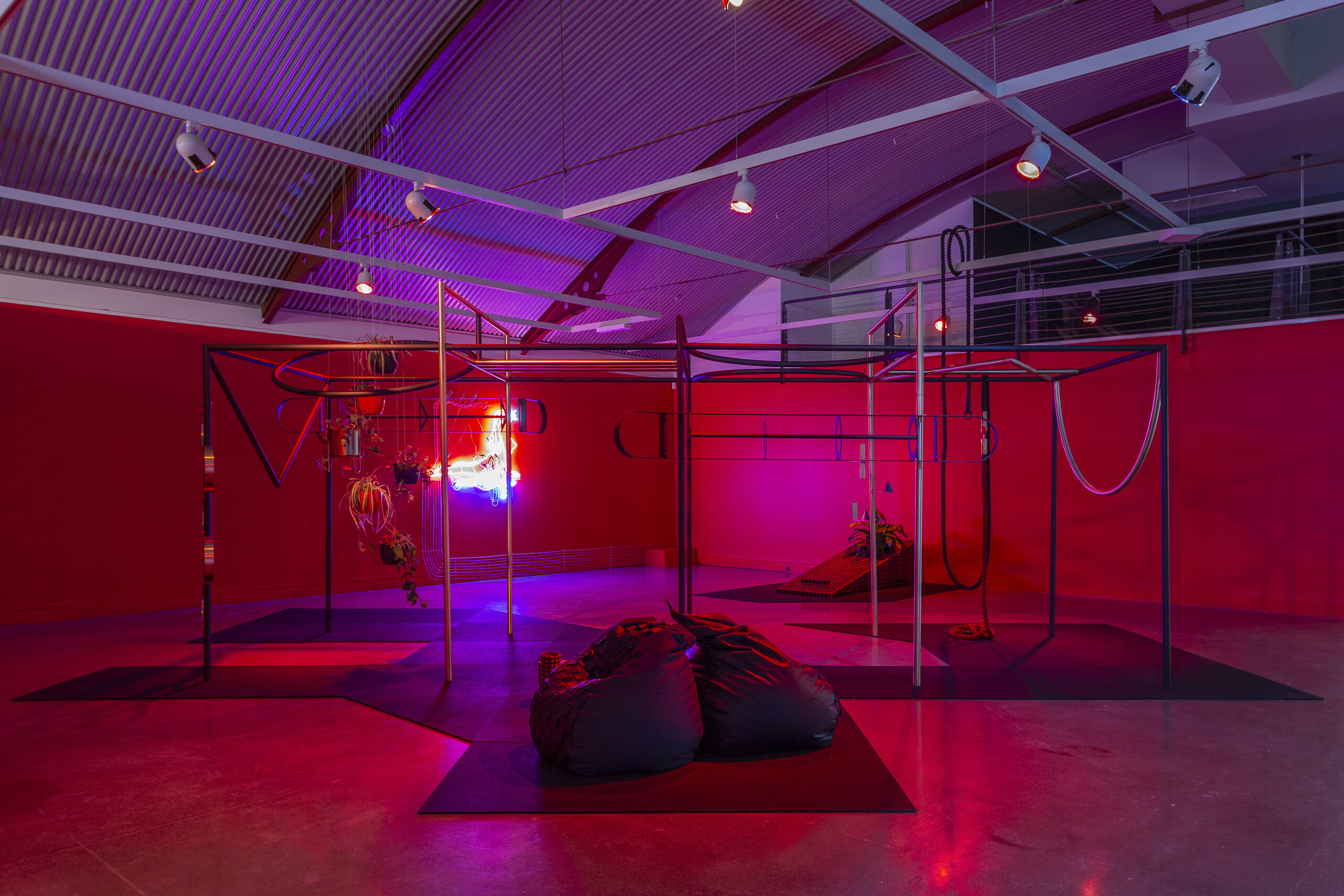 Min Wong, <em>Looking in the mirror, THAT is the only competition</em>, 2022. Steel, brass, paint, plants, ceramic, wire, crystals, books, rubber matting, robes, leather, denim. <em>Soul Seeker</em>, Cement Fondu, 2022. Photo: Jessica Maurer Photography.
