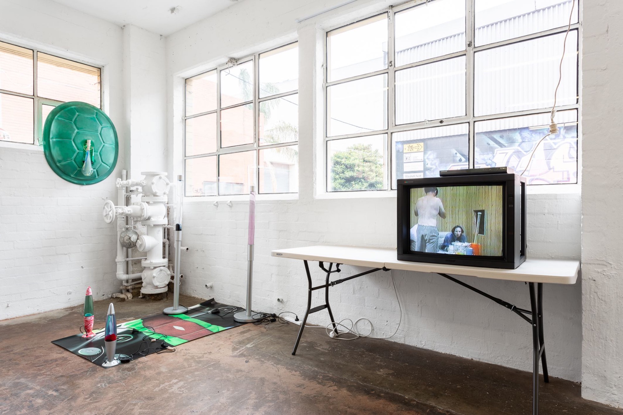 Spencer Lai, <em>A smile forms into a grimace mid-slumber as the earth spins— it’s funny, such is the sound of laughter — it is like god’s hands on the shoulders of a troubled world</em> (Second iteration). Installation view, Bus Projects. Photo: Christo Crocker.