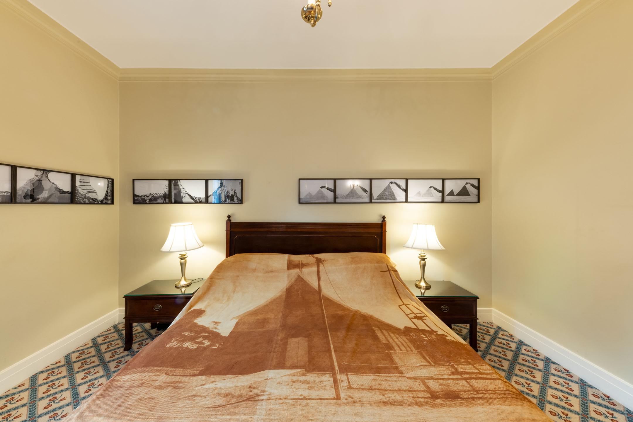Install shot of Ezz Monem (walls) and Yhonnie Scarce (bed) at This is no Fantasy’s suite. Image courtesy of Spring1883. Photo: Simon Strong.