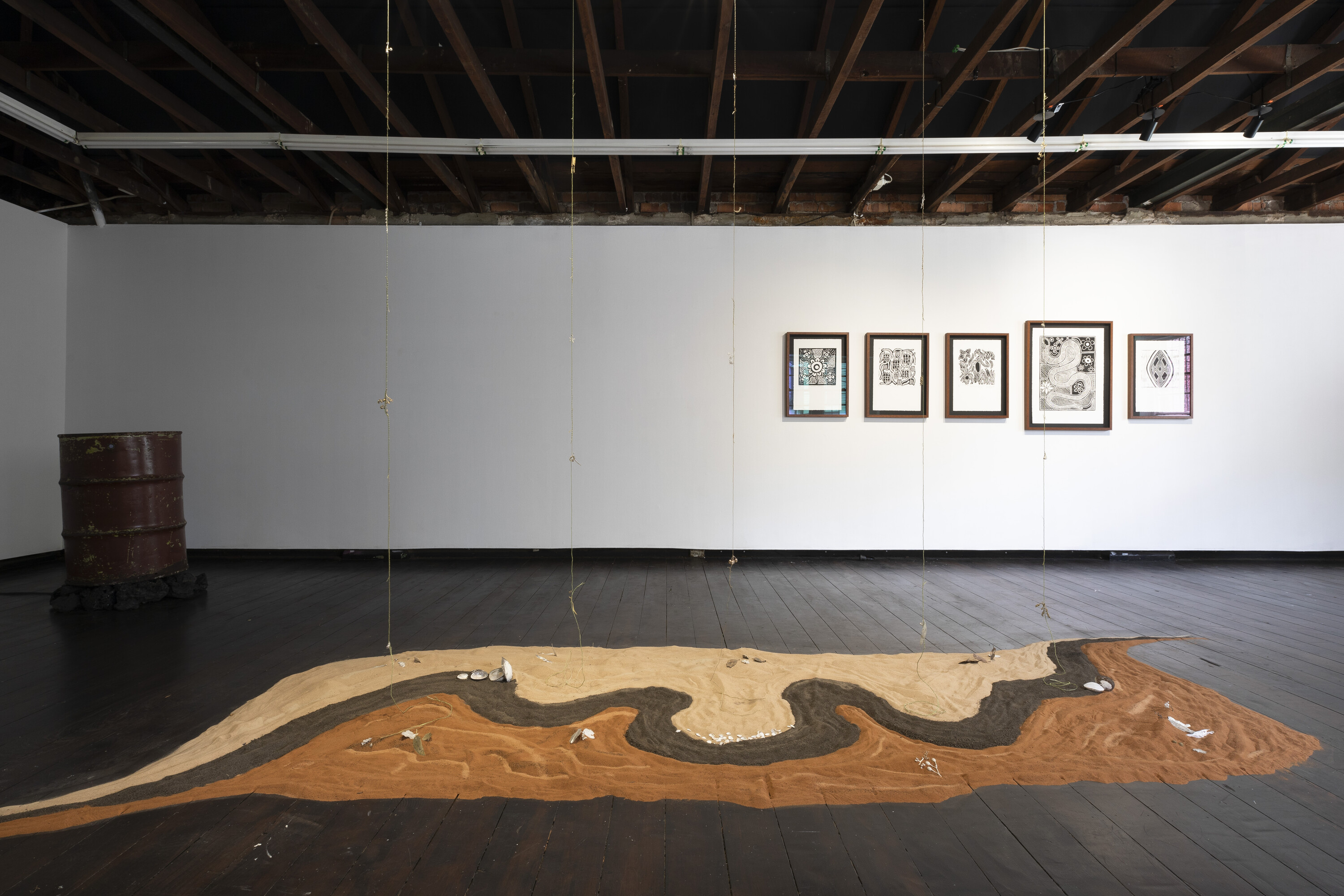 <ol><li><p><em>Still waters run deep</em> Installation shot, Dan Schulz, <em>hollowunderneath_version 5.xvid</em> (left). Barbara Quayle, <em>Palirika Barka Kiira, 2024 </em>(foreground) Tannya Quayle <em>Lino Cuts</em> (background) photo Jessica Maurer</p></li></ol>