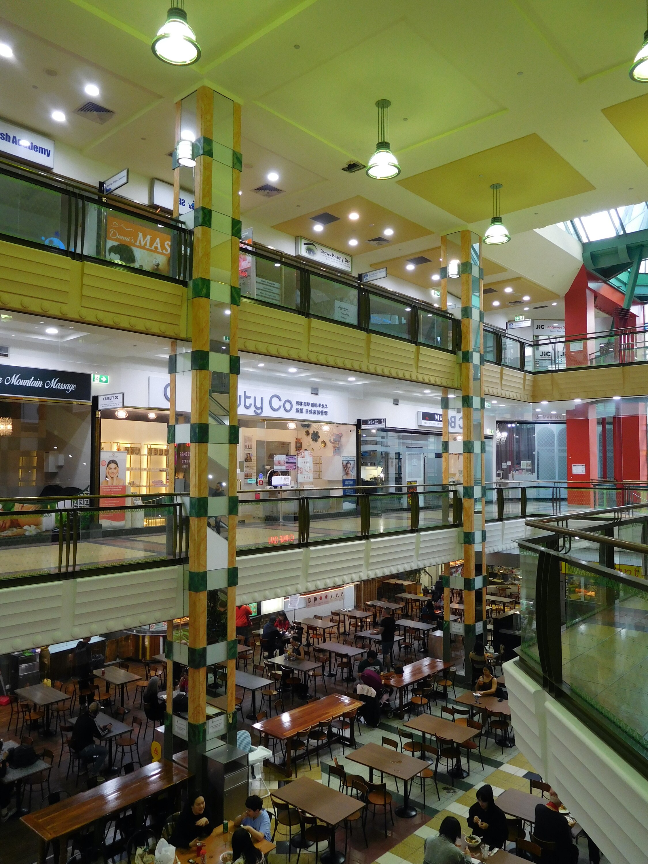 <p>The mirrored columns connect the lower three floors of the Paramount Centre. Photograph by author.</p>