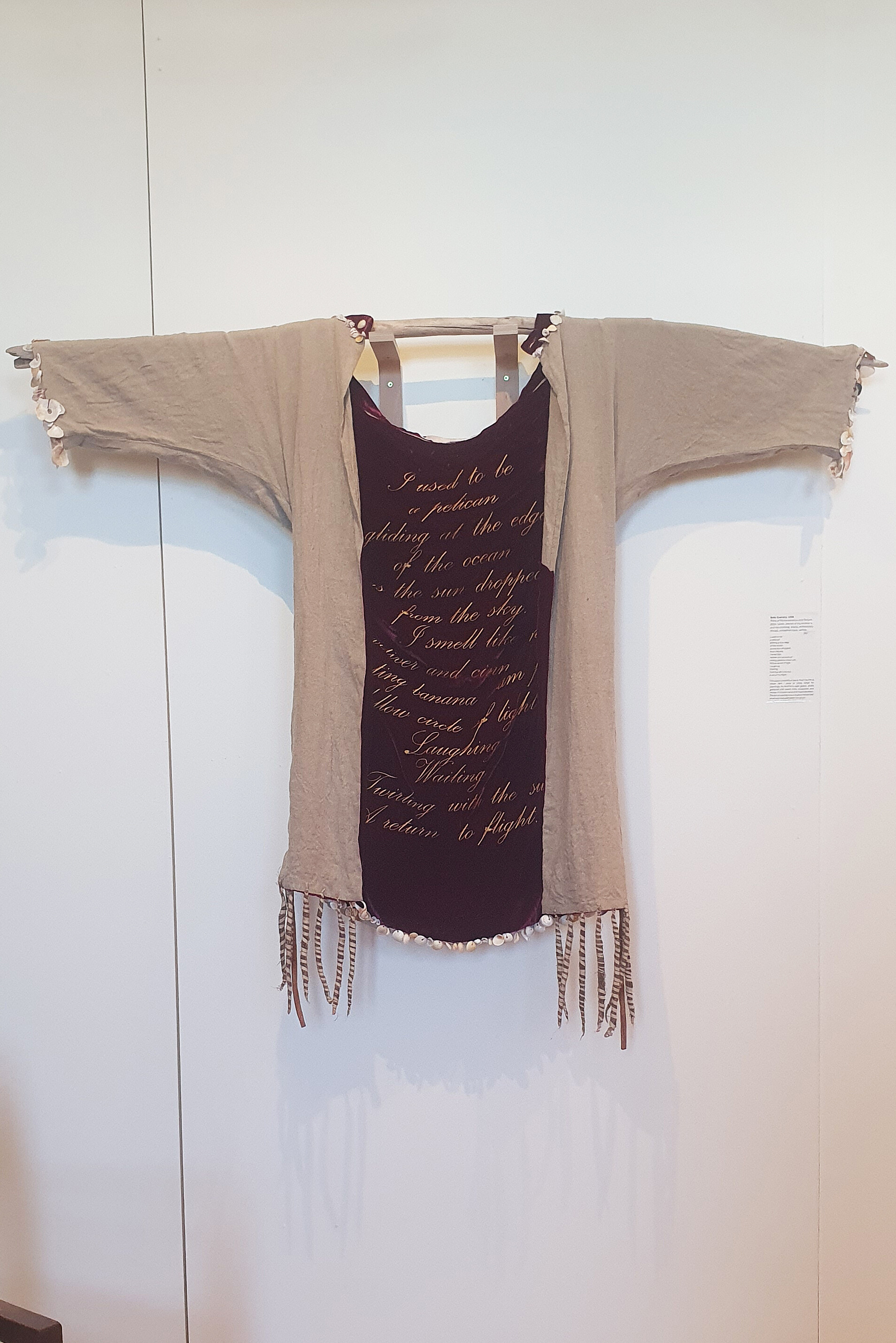 <p>Beth Krensky, <em>Robe of Remembrance and Return, </em>2024, linen, personal and family clothing, shells, embroidery thread, cinnamon bark, vetiver, 122 x 142 x 15 cm, East Gippsland Art Gallery. Photo: Akshatha Rangarajan</p>