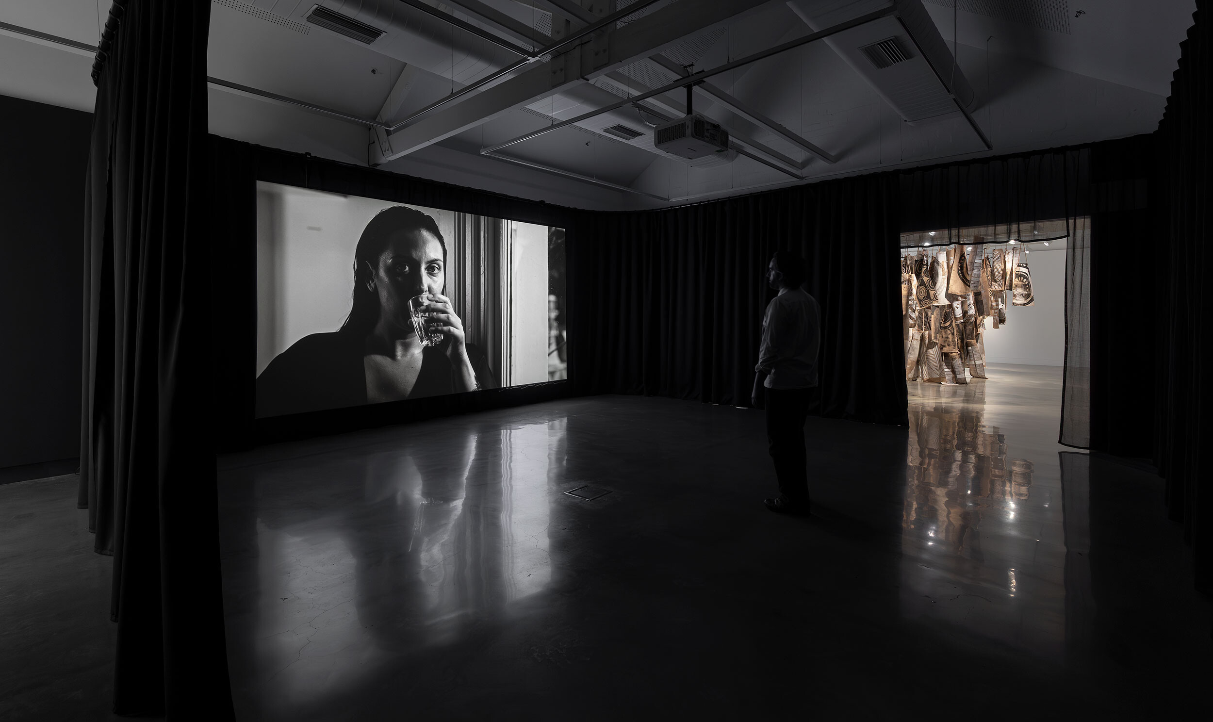 <p>Installation view of <em>The Veil</em>, Buxton Contemporary, the University of Melbourne. Featuring Hayley Millar Baker, <em>Nyctinasty</em>, 2021; Lisa Waup, <em>Holding Country</em>, 2024. Photography by Christian Capurro</p>