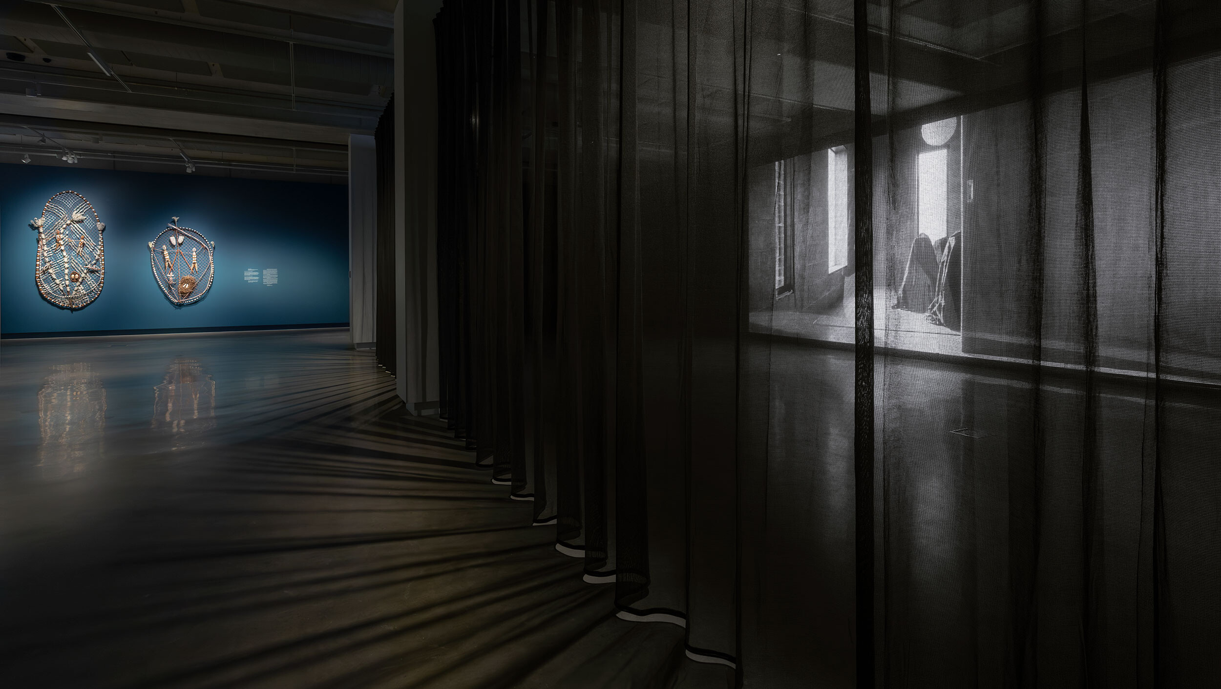 <p>Installation view of <em>The Veil</em>, Buxton Contemporary, the University of Melbourne. Featuring Lena Yarinkura, <em>Ngalmudj and Two Sisters, </em>2025; Hayley Millar Baker, <em>Eternity the Butterfly</em>, 2025. Photography by Christian Capurro</p>