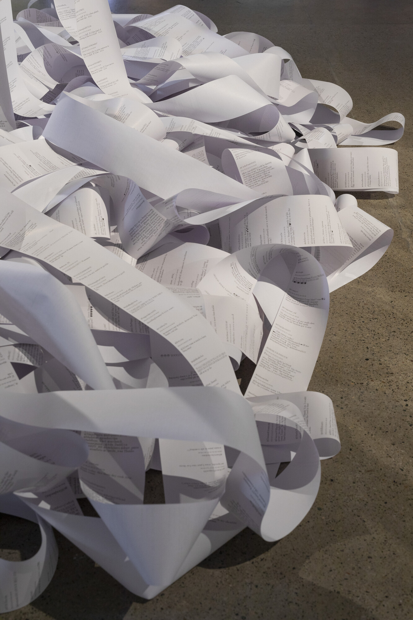 <p>Christopher Baker, <em>Murmur Study (2009-2024)</em>. 24 thermal printers, printer paper, custom software. <em>TMI</em> exhibition installation view, Cement Fondu, 2024. Photograph: Jessica Maurer.</p>