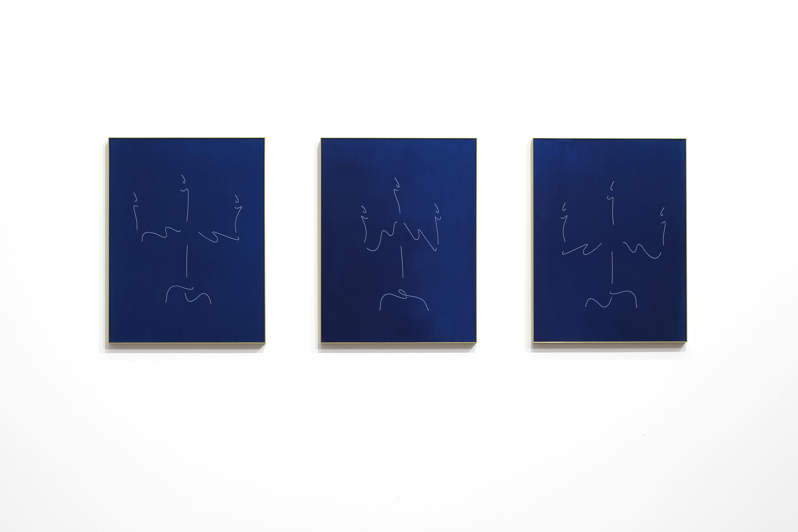 Tom Blake, <em>holding light (three instants) I-III</em>, 2022. Cyanotype, artist-made brass frames, 41 x 31 cm each, image courtesy the artist and N.Smith Gallery