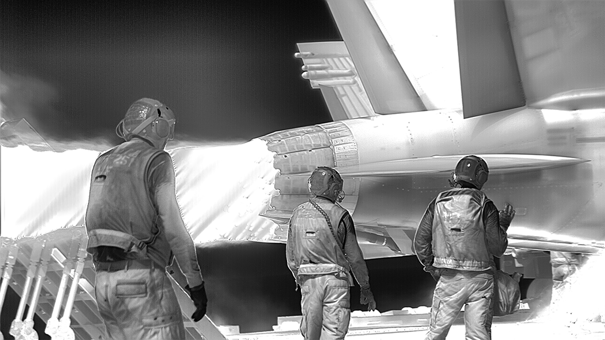 Richard Mosse, <em>Incoming</em>, (2015–16), three channel black and white high definition video, surround sound, 52 min 10 sec (looped). Cinematographer / Editor: Trevor Tweeten, Composer / Sound Designer: Ben Frost. Co-commissioned by the National Gallery of Victoria, Melbourne and the Barbican Art Gallery, London. National Gallery of Victoria, Melbourne. Purchased with funds donated by Christopher Thomas AM and Cheryl Thomas, Jane and Stephen Hains, Vivien and Graham Knowles, Michael and Emily Tong and 2016 NGV Curatorial Tour donors, 2017. © Richard Mosse Image courtesy Richard Mosse, Jack Shainman Gallery, New York and carlier|gebauer, Berlin.