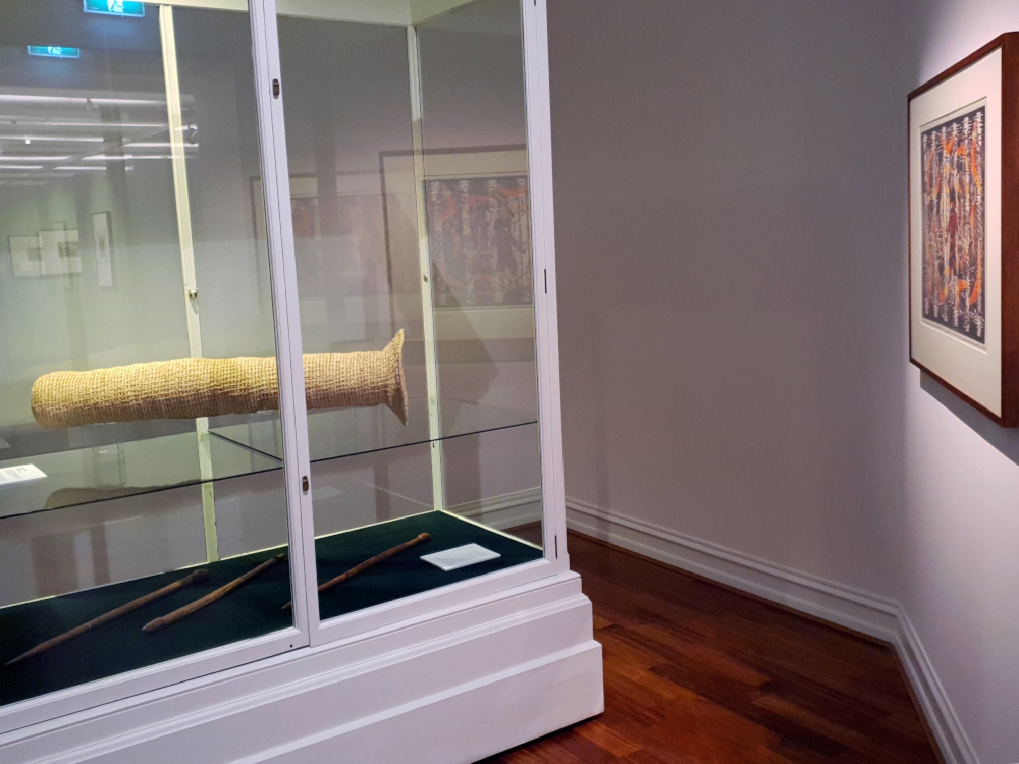 Installation detail of <em>On Country: Selected by Jordan Gould</em>; an exhibition created in partnership with the Koorie Heritage Trust and artist, Sidney Sprague, WAG presents the stories of Gunditjmara Elders: Uncle Robbie Lowe, Aunty Christina Saunders, Uncle Andy Alberts and Aunty Bronwyn Razem.