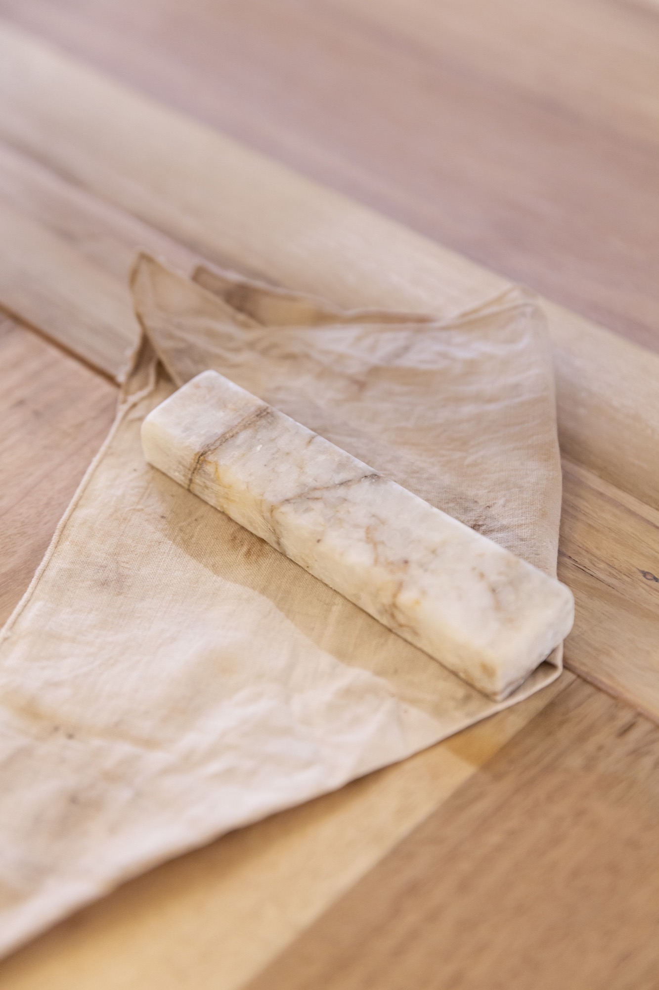 Fayen d’Evie, <em>Spine (—)</em>,  sanded oblong of Jurassic marble, 12 x 3cm. Courtesy of the artist. Photo: Janelle Low