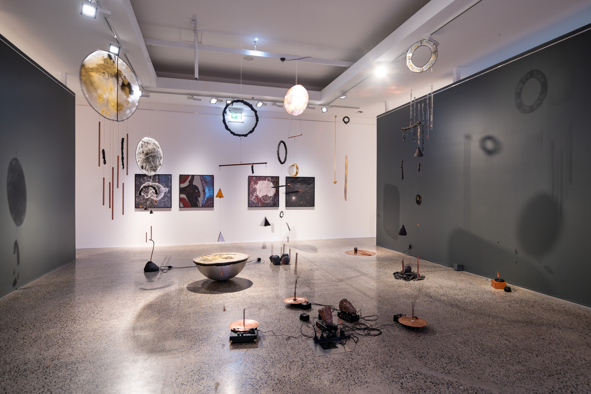 Installation view of <em>West of Central</em>, Bathurst Regional Art Gallery, 1 July–27 August 2023, featuring Vicky Browne, <em>Cosmic Noise</em>, 2018–ongoing, mixed media installation, dimensions variable. Courtesy the artist., Haines &amp; Hinterding, <em>Lichen and Stars 2 (Faulconbridge /NGC4755 Jewel Box Star Cluster),</em> 2021, pigment print on Ilford Gold Fibre Pearl 290gsm, 2 units each 93 x 93 cm (framed), and Haines &amp; Hinterding, <em>Lichen and Stars 4 (Kings Tableland / M8 Lagoon Nebula)</em>, 2021, pigment print on Ilford Gold Fibre Pearl 290gsm, 2 units each 93 x 93 cm (framed). Photo: David Roma Photography