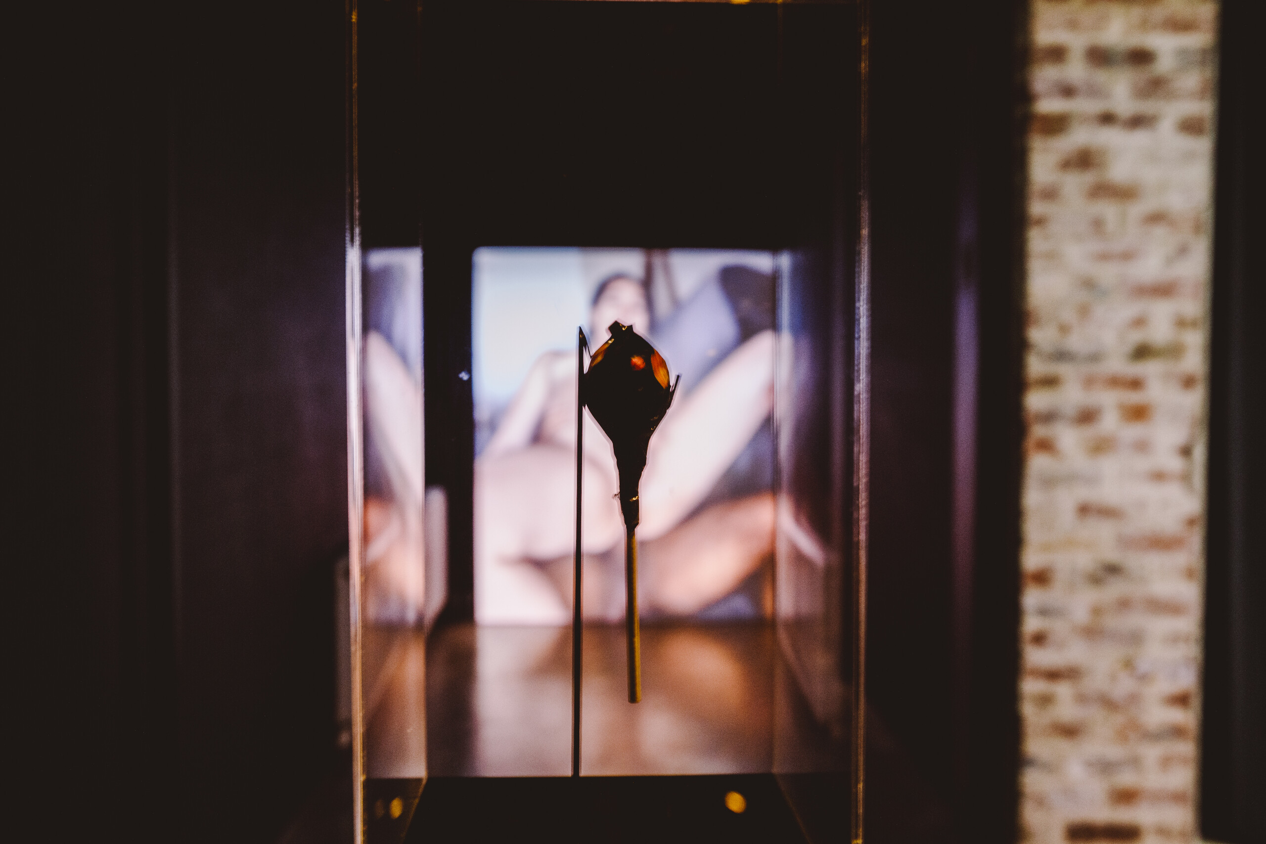 Ari Tampubolon, <em>booby trap : not that deep</em>, 2022, Lady Gaga Chromatic Ball Tour plastic wrapping, plastic stick, sour candy, installation view. Photo credit: Gianna Rizzo.